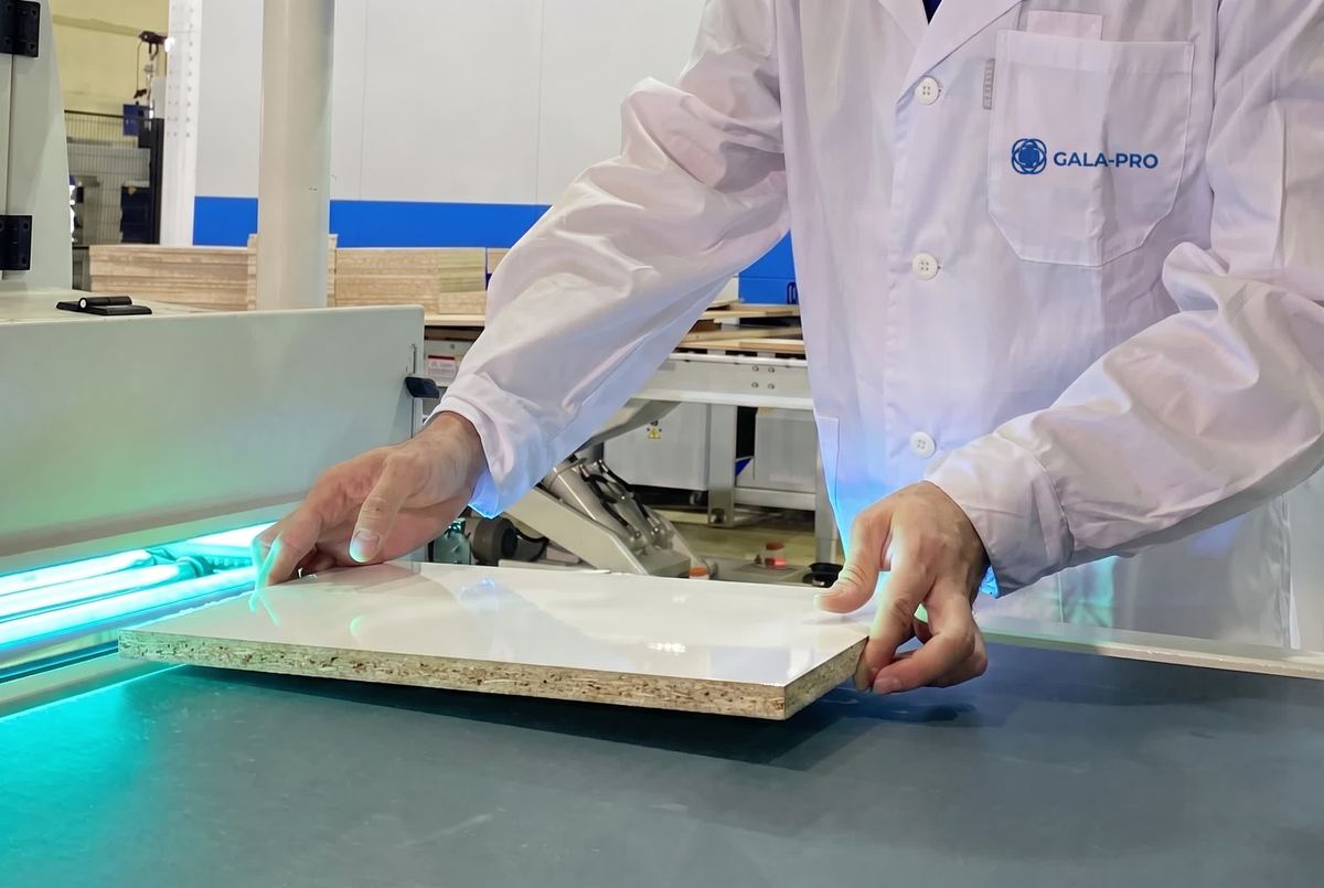 UV-cured gloss and matt coatings on a laminated panel